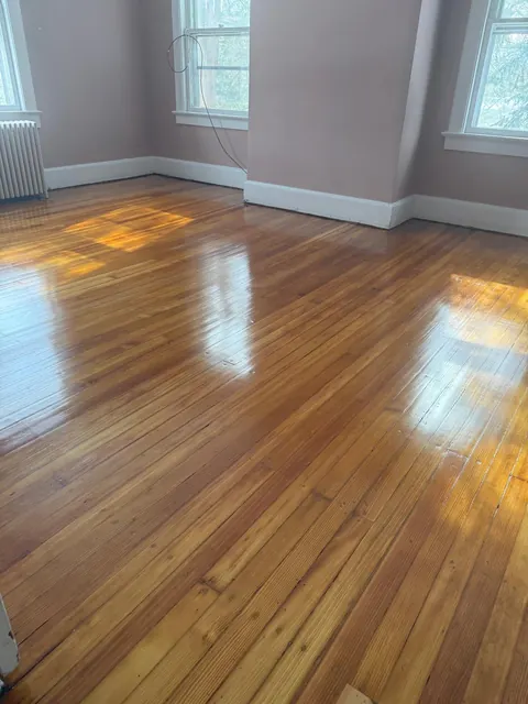 Refinished oak floor in a bedroom with natural light