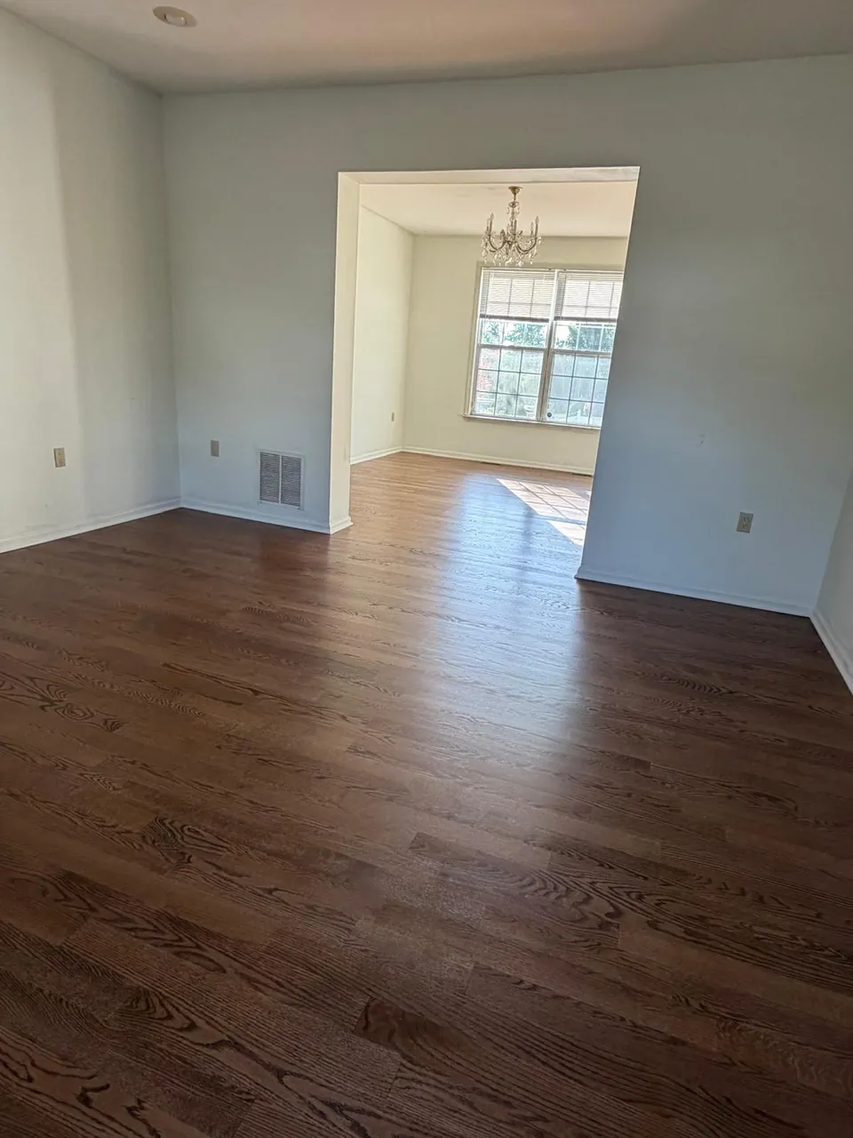 Dining room with a dark stained oak floor and a satin finish