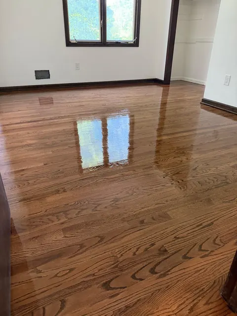 Refinished oak floor with dark walnut trim in a New Jersey bedroom