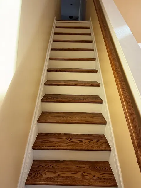 Refinished oak stair treads with white painted risers
