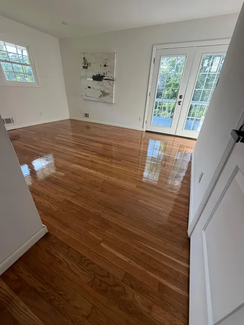 Living room with French doors and a glossy refinished oak floor