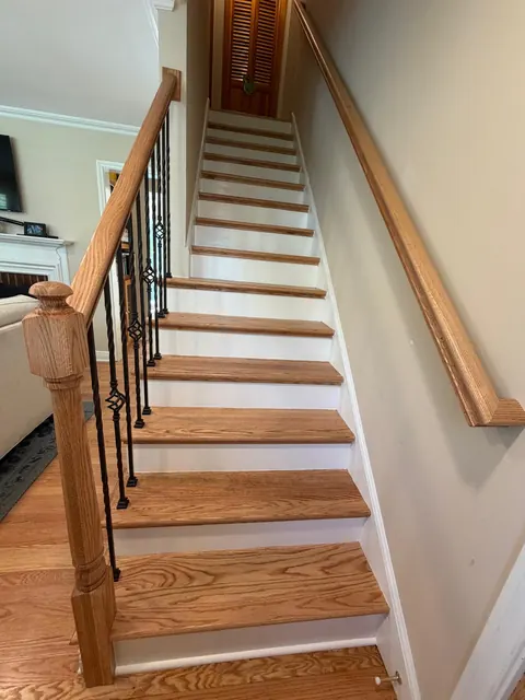Straight staircase with new oak treads, white risers and iron balusters