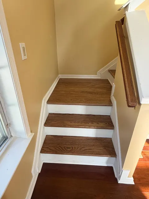 Three-step landing with refinished oak treads and white risers